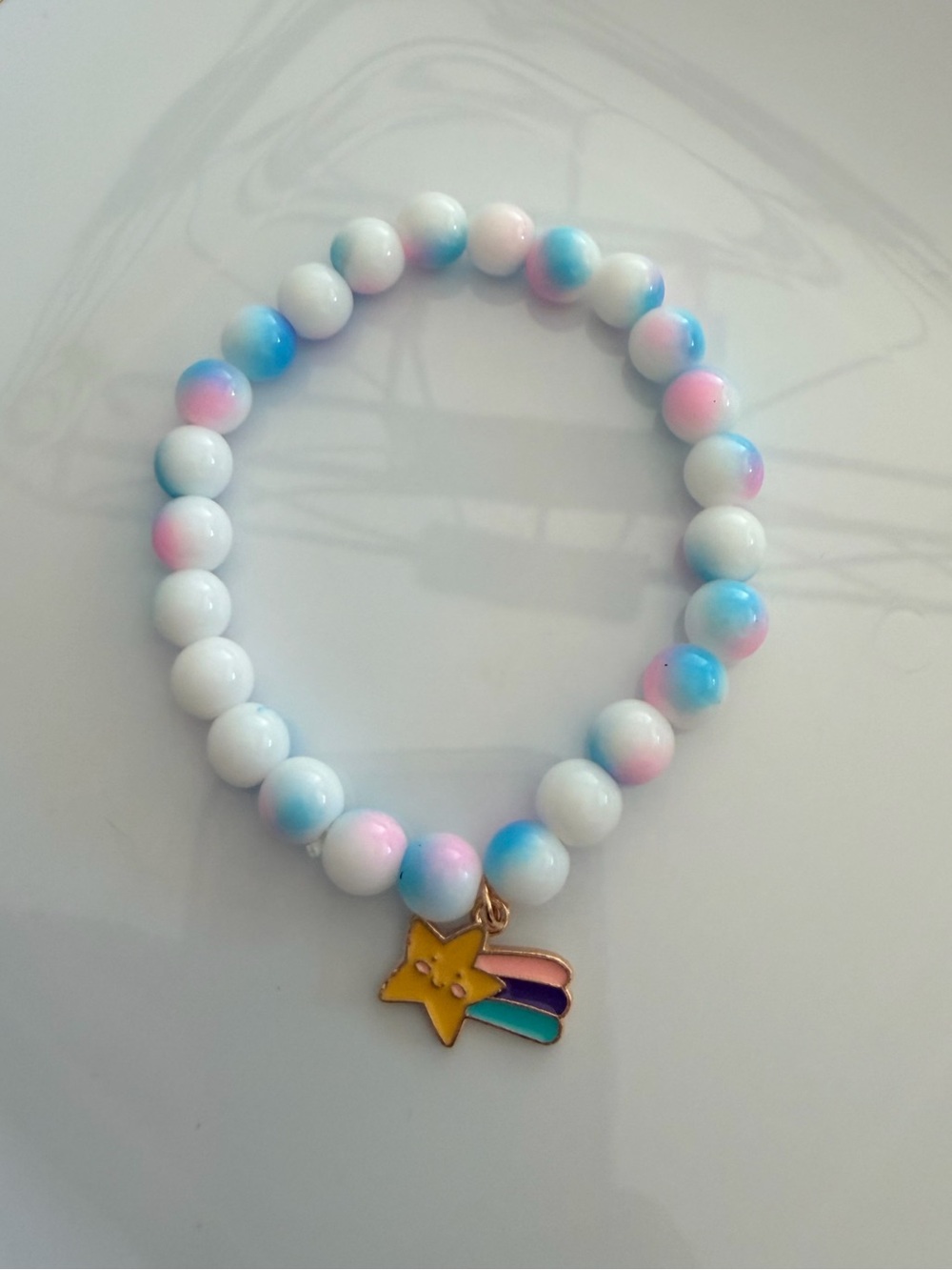 White Beaded Bracelet with Pink & Blue Accents and Gold Star Charm